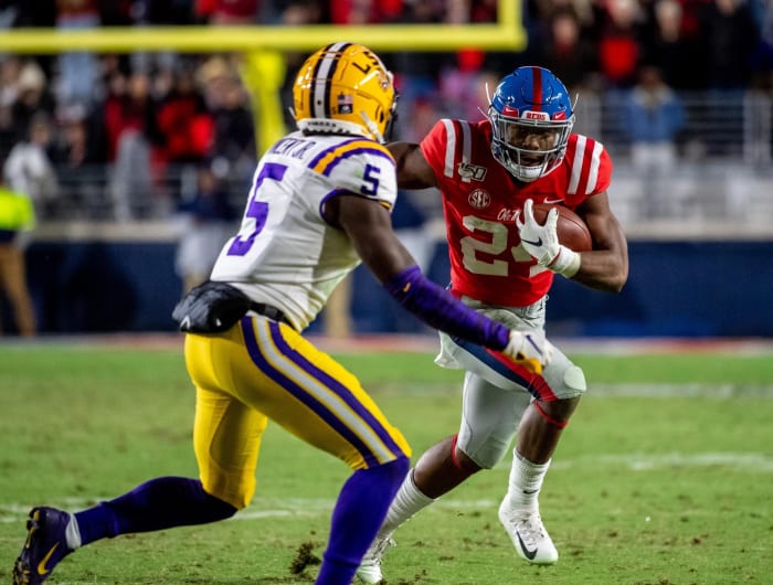 Mississippi Rebels running back Snoop Conner (24) runs at Louisiana State Tigers defensive back Kary Vincent, Jr. (5) at Vaught-Hemingway Stadium. Mandatory Credit: Vasha Hunt-USA TODAY Sports